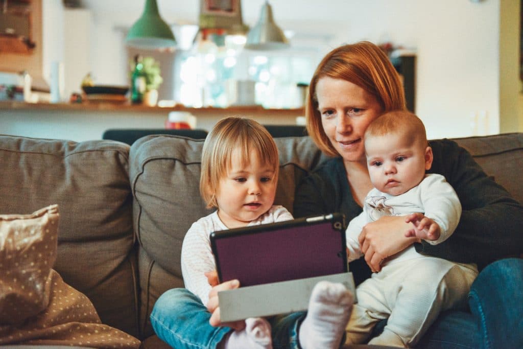 Mother, child and baby in the living room